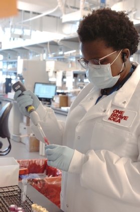 Photo of technician in a biotechnology lab.