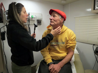 La Clinica nurse practitioners can examine patients experiencing homelessness from the parking lots of local churches in their 40-foot mobile centers.